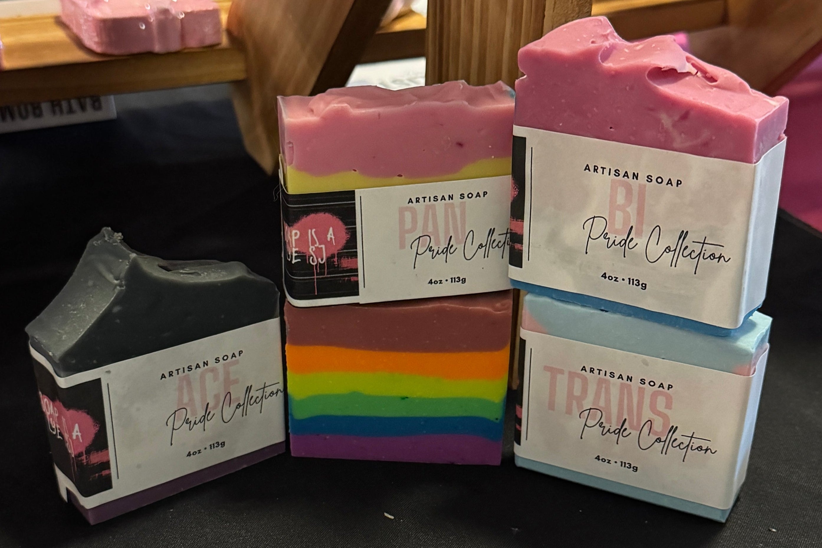 Stack of Handcrafted soapscelebrating LGBTQ Pride. Ace price, Pan Pride, Bi Pride, Rainbow, and Trans Pride are shown.