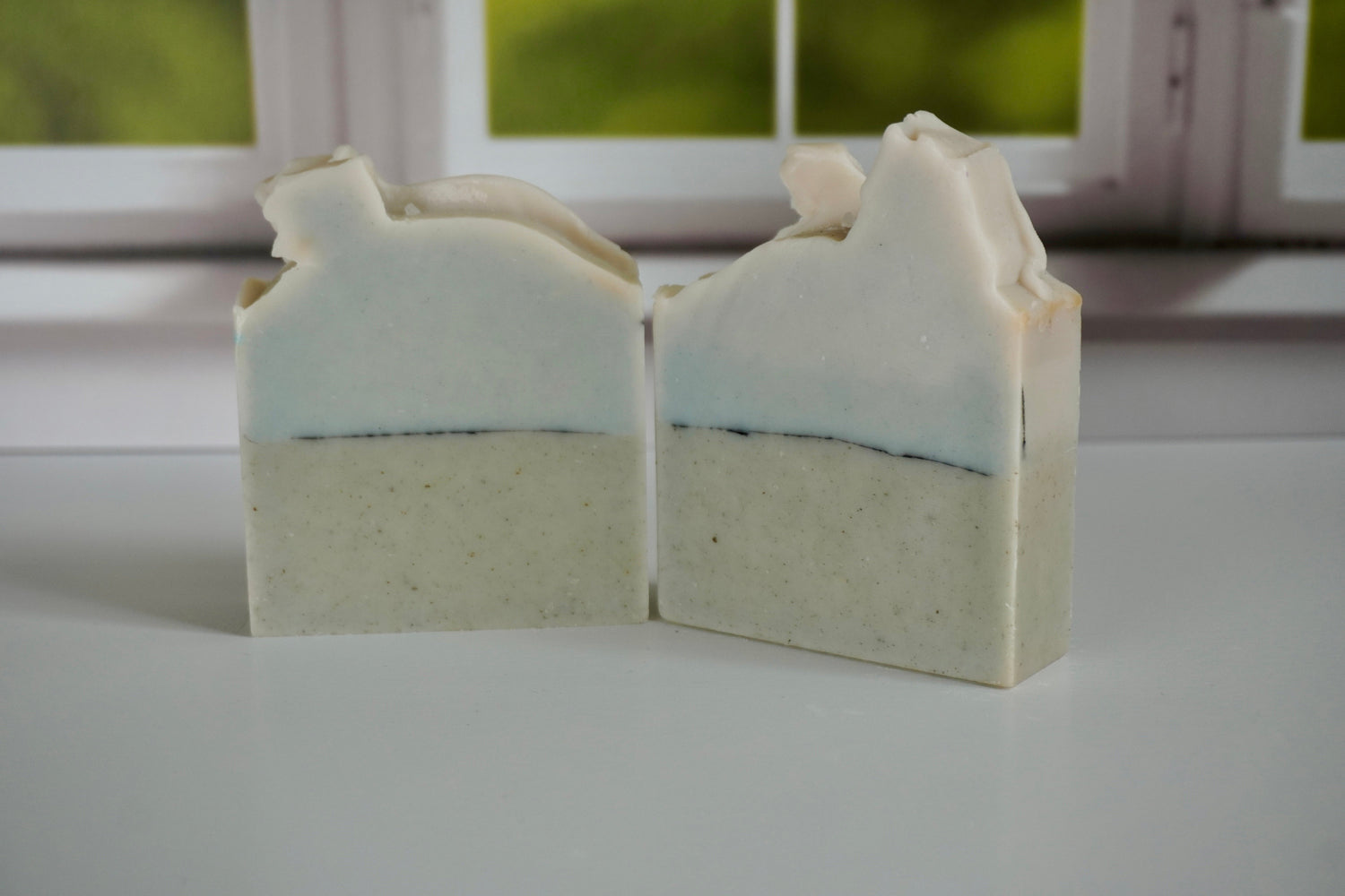 Sea salt and sand Artisan Soap sitting in front of a window
