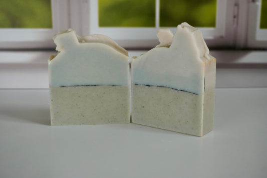 Sea salt and sand Artisan Soap sitting in front of a window
