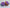 Two donut bath bombs with purple frosting one is blue and the other is orange