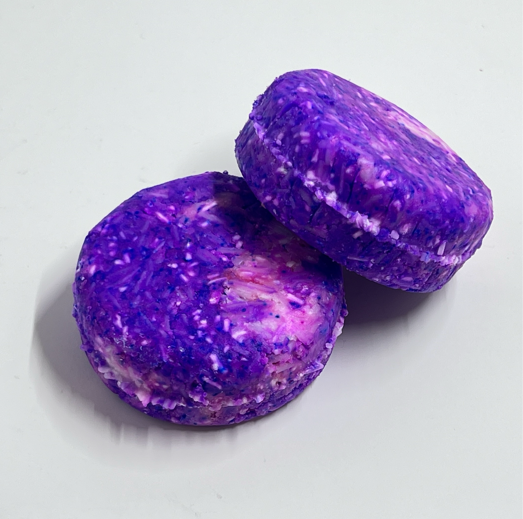 purple shampoo bar stacked on another purple shampoo bar